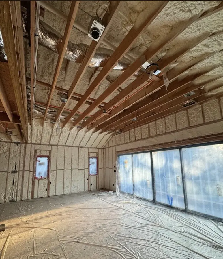Interior walls and ceiling insulated with spray foam during new construction in Williamsport